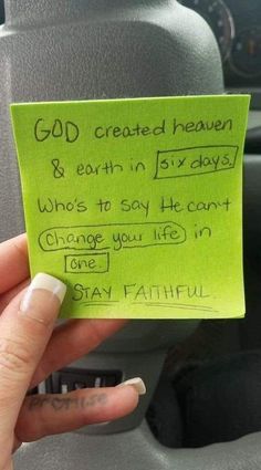 someone is holding up a green post - it note that says god created heaven and earth in six days