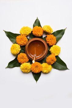 an orange and yellow flower arrangement on a white background stock photo