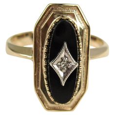 This beautiful ring contains a center oval black onyx that contains a white gold plaque in a diamond shape that contains an old mine cut diamond. The ring is a 10.5 and can be sized by us or your jeweler. Be sure to check our storefront for hundreds of pieces of Fine, costume jewelry, sterling silver, and vintage clothing! Any questions please call, email or hit contact. Thanks! Antique Onyx Ring, Vintage Black Ring, Vintage Onyx Ring, Onyx Rings, Gothic Engagement Ring, Purple Stone Rings, Onyx Engagement Ring, Old Mine Cut Diamond, Black Jewel