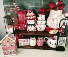 a shelf filled with lots of different types of candy and cookies on top of it