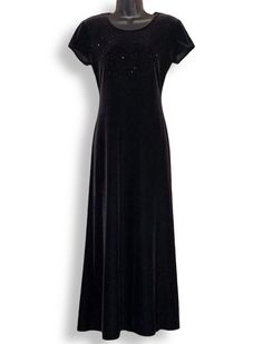 "Vintage Black Velvet Beaded Neck Maxi Dress Label: JR Nites Petites By Caliendo Size: M Length: 53.5\" Front Pit to Pit: 18\" Waist: 30\" Fabric: 90% Polyester, 10% Spandex  Color: Black  Beaded front neckline detail Zipper Back Velvet, knit, stretch  Condition: Vintage, Preowned, In like new condition with no stains or damages, Looks brand new PLEASE READ BEFORE PURCHASING THIS ITEM: Please note that every vintage item listed is handpicked, rare, unique & in pristine condition. (If any flaws it will be listed above) *Colors may be slightly different with photo editing and brightness Though I do thoroughly look at every item before listing/sending off for flaws, I can mistakenly overlook a blemish. So please don't fault if I miss a flaw. (All items can be easily dry cleaned.) *Prices are Sundress Long, Velvet Knit, Long Sundress, Dress Label, Velvet Maxi Dress, Knit Short, Long Black Dress, Knit Shorts, Dress Clothes For Women