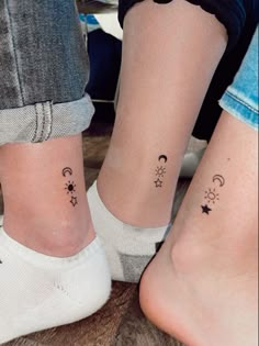 two people with matching tattoos on their feet, one has stars and the other has crescents