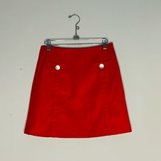 Super Chic Red Mini Skirt. Gold Button Pocket On Front. Wool Like Feel. New With Tags Red Cotton Bottoms With Buttons, Red Mini Skirt With Button Closure, Retro Red Skort, Red Buttoned Skirt, Red Buttoned Bottoms For Work, Fitted Red Skirt With Button Closure, Red Skort With Pockets For Spring, Red Summer Skirt With Button Closure, Red Fitted Skirt With Buttons