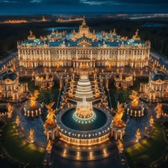 the palace is lit up at night with lights on it's facade and fountains