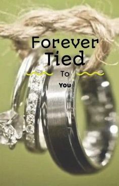 two wedding rings tied to each other with the words forever tied to you