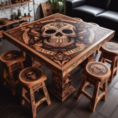 a wooden table with skulls on it and four stools in front of the table