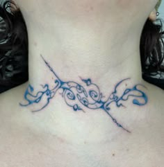 a woman with a tattoo on her neck