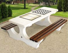 a park bench with a chess board on it