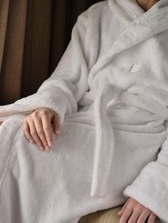 A staple in House bedrooms and Cowshed spas, our House robe is great for unwinding post-shower. Crafted from 100% recycled polyester with an embroidered Soho House logo on the chest, the robe has a fluffy, soft texture and is designed with a hood for extra comfort. Gift it to a friend, or keep it for yourself for cosy, everyday lounging.. Fluffy hooded robe with attached belt. 100% recycled polyester. GRS-TR certification (Global Recycled Standard). Made by Italian textiles company Frette. Embro Soho House Robe, Soho House Barcelona, Shoreditch House, Flannel Robe, Lounge Interiors, Book Mood, Italian Textiles, Soho Home, Hooded Robe