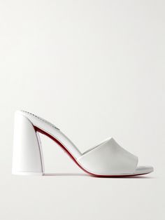 Christian Louboutin gives understated styles of the '90s a fresh update, resulting in these 'Jane' mules. Made from smooth leather, they have a wide strap and are set on a sculptural block heel that adds 85mm of lift. The sole is coated with the house's signature red lacquer. Christian Louboutin Mules, Designer White Leather Mules, Designer White Slip-on Mules, White Mules Heels, White Leather Slip-on Mules, Louboutin Shoes Clogs & Mules, Red Leather Coat, Build Wardrobe, Christian Louboutin Women