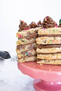 The perfect cake is made out of cookies and frosting. If you’re team ‘cake doesn’t have to be cake’ you’ll love this cookie cake! Chocolate chip cookie cake is really just stacked cookies with frosting in between the layers and piped on top. It gives the appearance of a cake, but with all the ease and delicious, buttery, gooey textures of your favorite cookie. | how to make a cookie cake | chocolate chip cookie layer cake | chocolate chip cookie cake ideas | cookie layer cake recipe