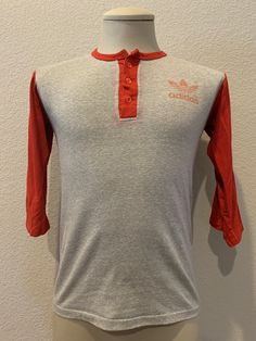 "Good Shape. Some minor discoloring on front and minor wear on lower back seam as shown Pit to pit is 18\" Top to bottom is 24\" Tag size: S Zacarrie21 1985 Room D" Retro Long Sleeve Sports T-shirt, 90s Style Red T-shirt For Sports, Red Three-stripes Tops For College, Red Three Stripes Top For College, Retro Red Crew Neck Top, Retro Red College Tops, Retro Red Long Sleeve T-shirt, Retro Red Tops For College, Red Retro Tops For College