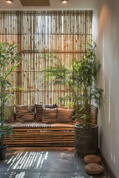 an indoor living room with bamboo blinds and plants in the corner, along with potted trees