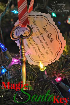 a christmas ornament hanging from a tree with lights on it and the words, magic