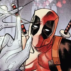 the deadpool is holding up his hand