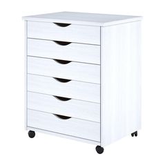 a white dresser with four drawers on wheels