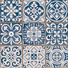 blue and white tiles with different designs on them