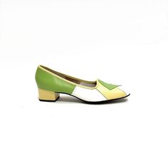 Vintage 1970s deadstock colorblock pieced leather slip on heels by Naturalizer. Features spring green, pastel yellow and white pieces leather uppers. With rounded toe, slip on style, and yellow leather block heel. With original shoebox and sales receipt. Excellent like new vintage condition.   Heel to toe (inside shoe): 10.625 inches  Ball of foot (bottom of sole): 3.125 inches  Heel height: 1.625 inches  Size 10 Green Low Heel Retro Heels, Retro Green Round Toe Heels, Retro Green Heels With Round Toe, Green Retro Heels With Round Toe, Retro Green Closed Toe Heels, Green Retro Closed Toe Heels, Green Closed Toe Retro Heels, Retro Green Leather Heels, Green Leather Retro Heels