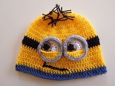 a crocheted hat with eye glasses on it