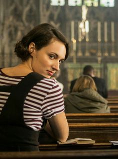 a woman sitting at a table in a church