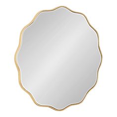 a round mirror with gold trimmings on the edges and an oval shaped frame