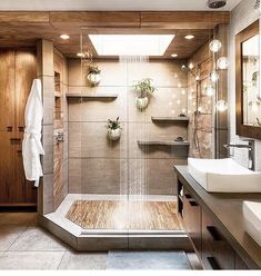 a bathroom with two sinks and a shower