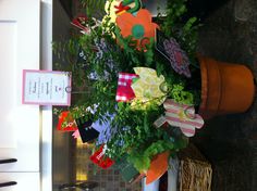 a potted plant sitting on top of a kitchen counter covered in paper cutouts