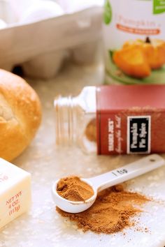 bread, butter and other ingredients are on the counter next to an egg carton