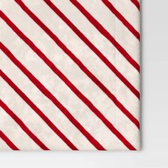 a red and white striped napkin on top of a table