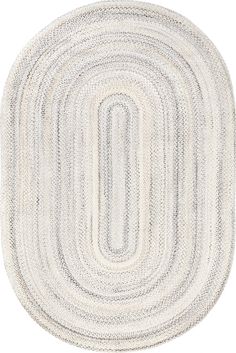 a white rug with an oval design on it