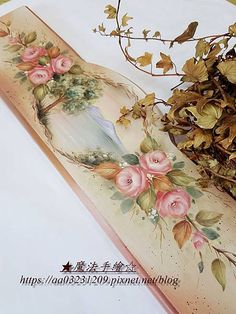 a painting on the side of a table with flowers