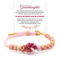 a pink and white braid bracelet with an inspirational quote on it that says, i can't be brave and strong