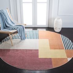 a chair and rug in a room