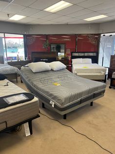 several mattresses are on display in a store