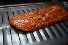 a piece of meat sitting on top of a grill