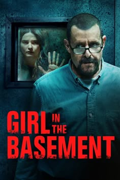 a man standing in front of a mirror with the words girl in the basement on it