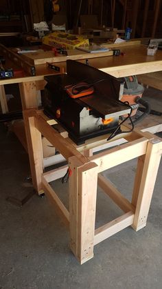 a workbench with tools on it in a garage