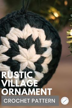 a crocheted ornament hanging from a christmas tree with the words rustic village ornament on it