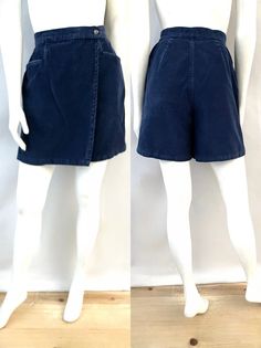 "Vintage 80's Blue, High Waisted, Corduroy, Skorts (M) These Ladies Skort comes in navy blue corduroy with two front pockets and have a skirt in the front with front zipper and single button closure and shorts in the back. The fabric is medium weight and does not stretch and has a matte surface. By David Hollis 100% Textured Fortel Polyester Made in Mexico *These skorts are in like new condition. Size: (M) Modern Day 6 (Tag Size: 8) Waist: 26\" Length: 13\" Hips: 36\" Inseam: 6\" Rise: 13\" (front) 14\" (back) Leg Opening: 12\" Weight: 14 oz *Follow FreshandSwanky on Instagram" Fitted Blue Corduroy Bottoms, Blue High-waist Corduroy Bottoms, Blue High Waist Corduroy Bottoms, High Waist Blue Corduroy Bottoms, Blue Corduroy Bottoms With Pockets, 80s Shorts, Collar Tips, Burgundy Shorts, Blue Corduroy