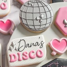 decorated cookies are displayed on a table