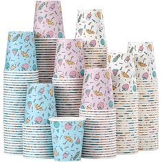 a stack of paper cups with different designs on them, all in pastel blue and pink