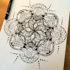 a drawing on paper with some lines and circles in the middle that are connected to each other