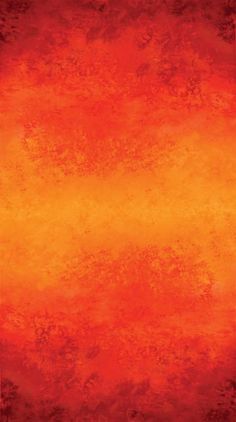 an orange and red background with some black spots