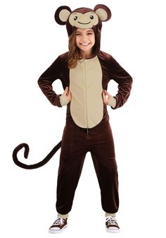 a girl in a monkey costume standing with her hands on her hips and smiling at the camera