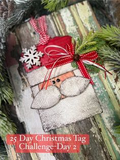 an ornament with a santa clause on it and the words 25 day christmas tag challenge - day 2