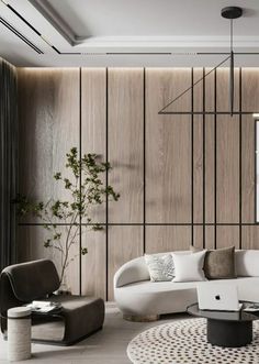 a modern living room with white furniture and wood paneling on the walls, along with a round coffee table