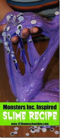 a close up of a person holding a purple object with googly eyes on it