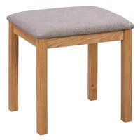 a wooden stool with a gray seat cushion