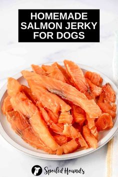 homemade salmon for dogs on a white plate with text overlay that reads homemade salmon jerry for dogs