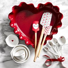 red heart shaped dish with utensils in it